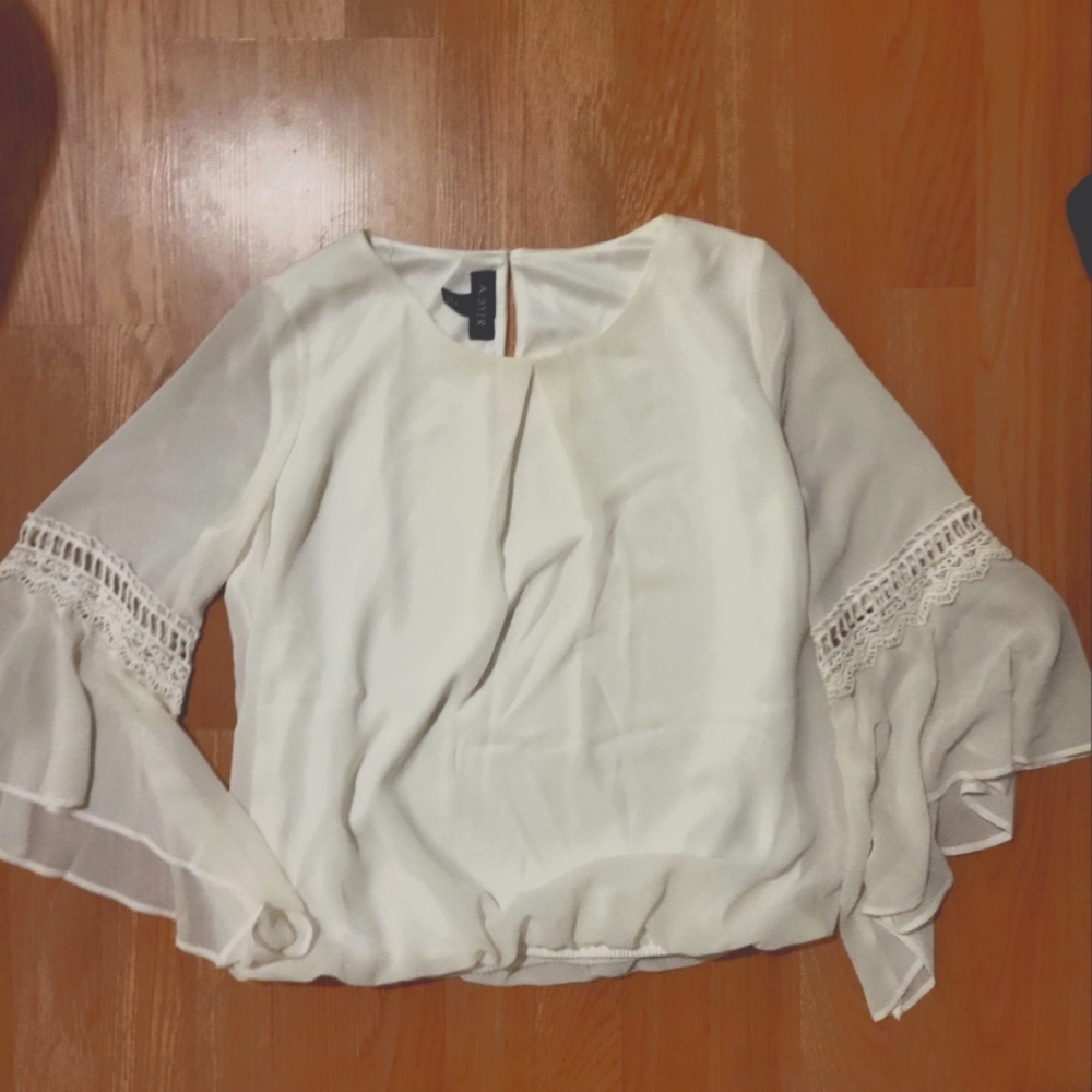 White blouse with lace detail and flowy sleeves